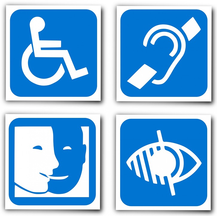 Représentation des 4 pictogrammes symbolisant la mobilité réduite, la surdité, la déficience visuelle et le handicap mental